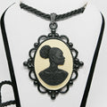 Cameo necklace with a profile of a woman on a white background