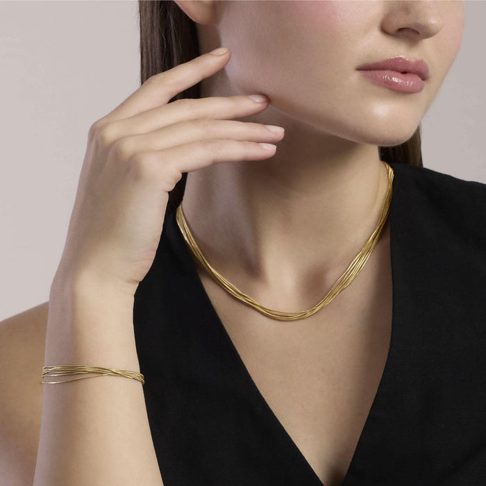 Girocollo in acciaio dorato con catene snake