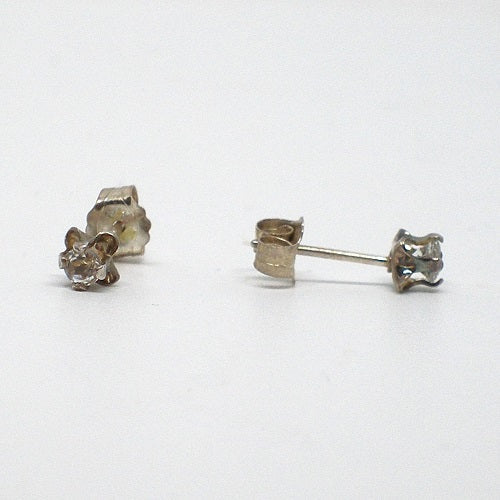 Pair of gold plated stud earrings on a white background